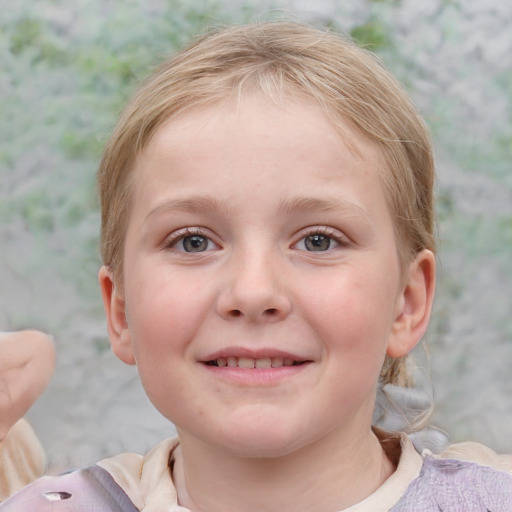 Joyful white child female with short  brown hair and blue eyes