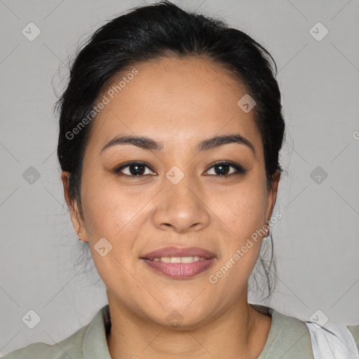 Joyful latino young-adult female with medium  brown hair and brown eyes