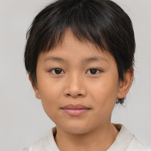 Joyful asian child female with medium  brown hair and brown eyes