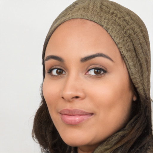 Joyful latino young-adult female with long  black hair and brown eyes