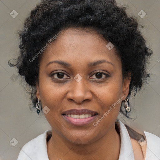 Joyful black adult female with medium  brown hair and brown eyes