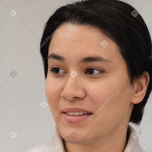 Joyful asian young-adult female with medium  brown hair and brown eyes