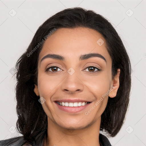 Joyful latino young-adult female with long  black hair and brown eyes