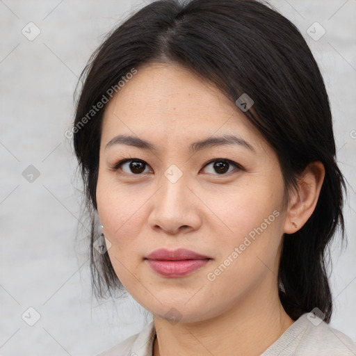 Joyful asian young-adult female with medium  brown hair and brown eyes