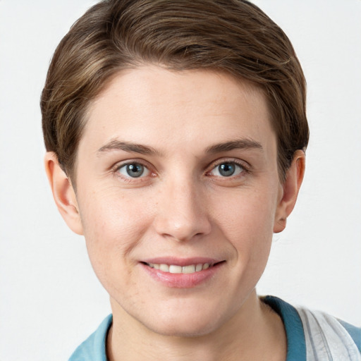 Joyful white young-adult female with short  brown hair and grey eyes