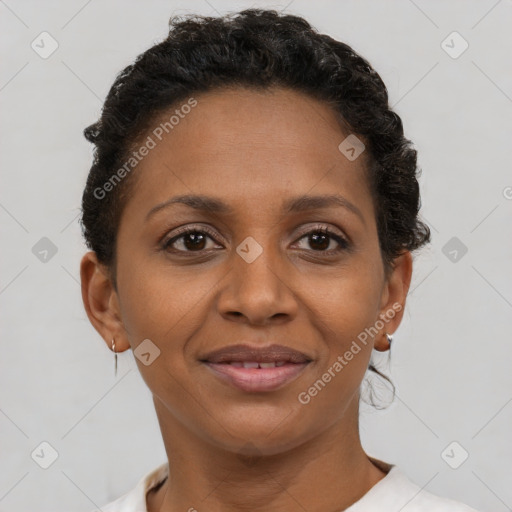 Joyful black young-adult female with short  brown hair and brown eyes