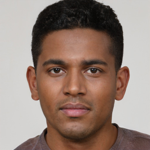 Neutral black young-adult male with short  brown hair and brown eyes