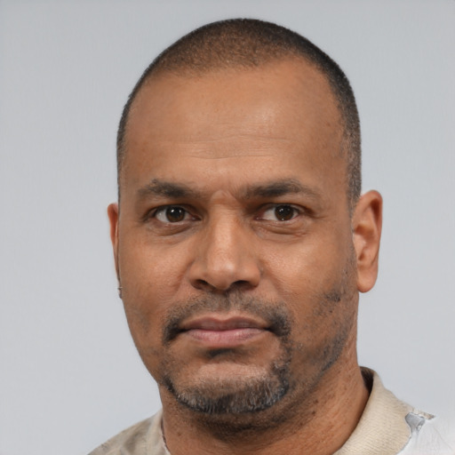 Neutral latino adult male with short  black hair and brown eyes