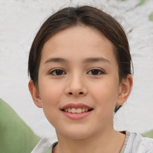 Joyful white child female with short  brown hair and brown eyes