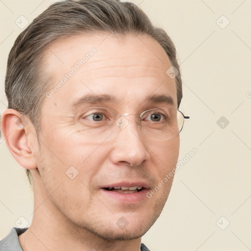 Joyful white adult male with short  brown hair and grey eyes