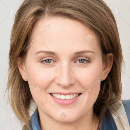 Joyful white young-adult female with medium  brown hair and blue eyes