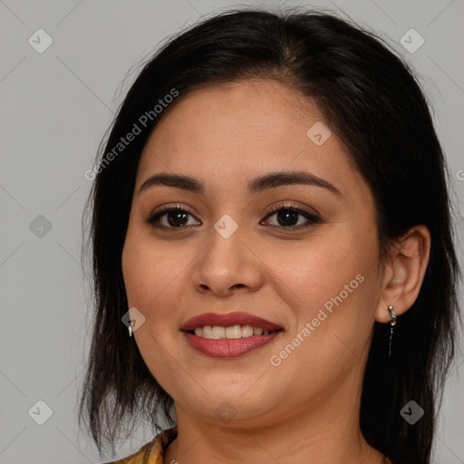 Joyful latino young-adult female with long  brown hair and brown eyes