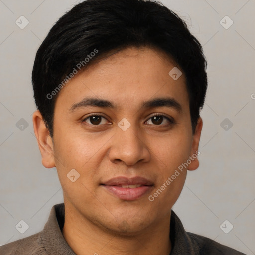 Joyful latino young-adult male with short  black hair and brown eyes