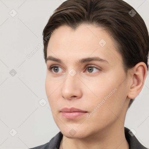 Neutral white young-adult female with short  brown hair and brown eyes