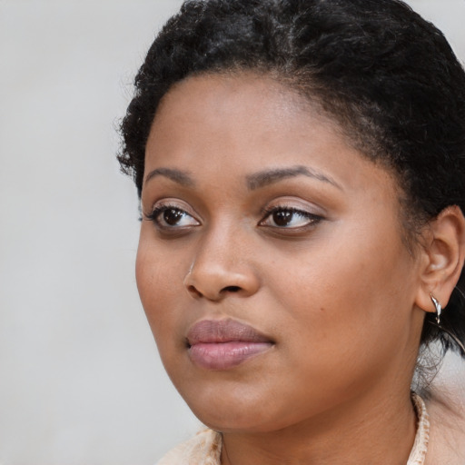 Neutral black young-adult female with short  brown hair and brown eyes