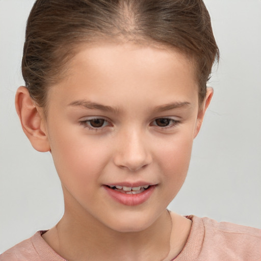 Joyful white child female with short  brown hair and brown eyes