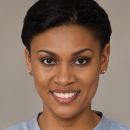 Joyful black young-adult female with short  brown hair and brown eyes