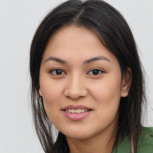 Joyful asian young-adult female with long  brown hair and brown eyes