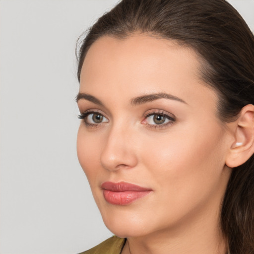 Neutral white young-adult female with medium  brown hair and brown eyes