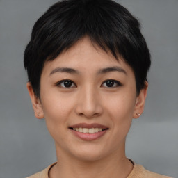 Joyful asian young-adult female with short  brown hair and brown eyes