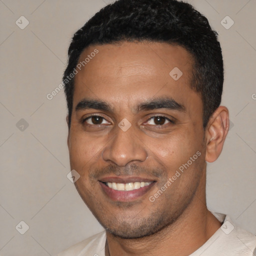 Joyful black young-adult male with short  black hair and brown eyes