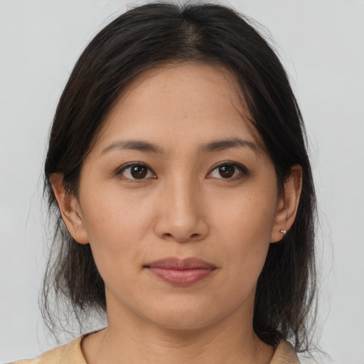 Joyful white young-adult female with medium  brown hair and brown eyes