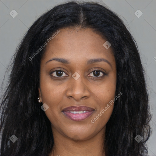 Joyful black young-adult female with long  black hair and brown eyes
