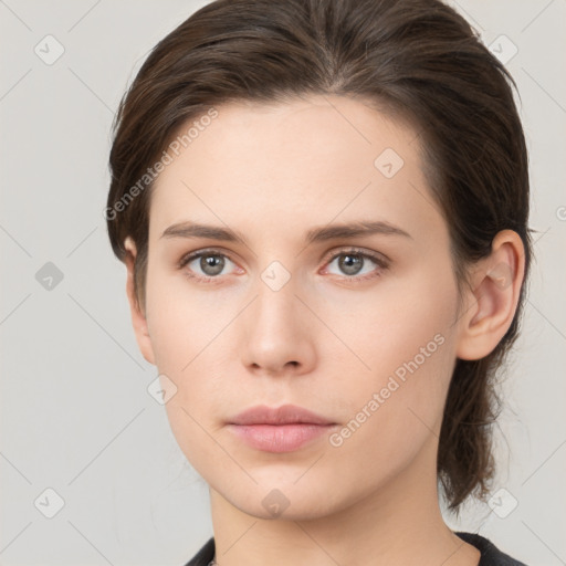 Neutral white young-adult female with medium  brown hair and grey eyes