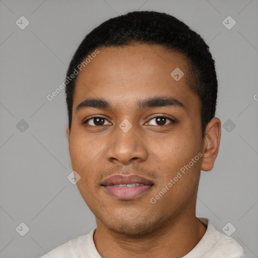 Joyful black young-adult male with short  black hair and brown eyes