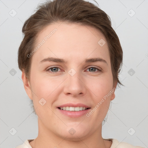 Joyful white young-adult female with short  brown hair and grey eyes