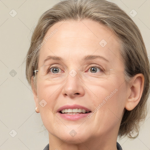 Joyful white adult female with medium  brown hair and grey eyes