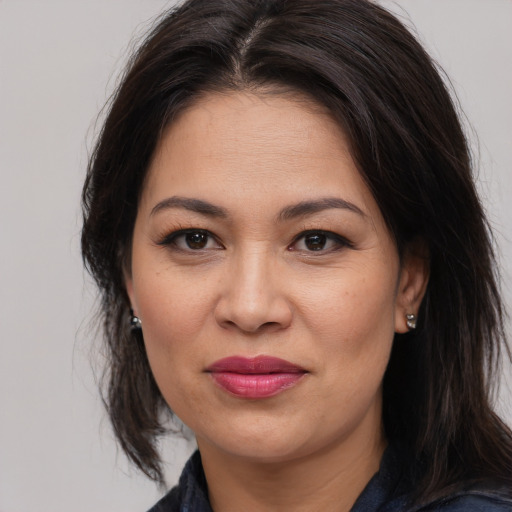 Joyful white adult female with medium  brown hair and brown eyes
