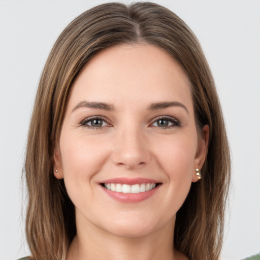 Joyful white young-adult female with long  brown hair and grey eyes