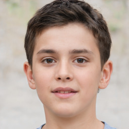 Joyful white child male with short  brown hair and brown eyes