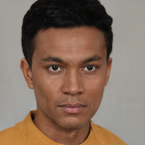 Neutral latino young-adult male with short  brown hair and brown eyes