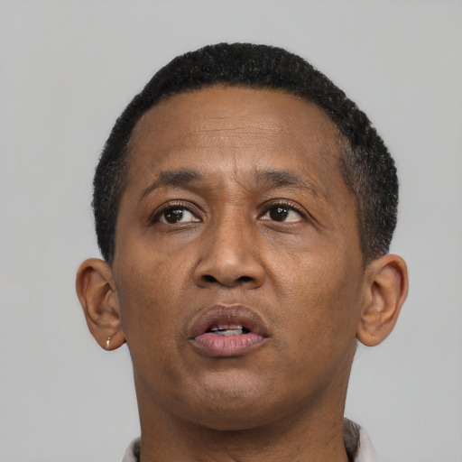 Neutral black adult male with short  brown hair and brown eyes