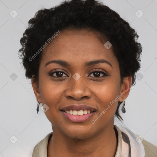 Joyful black young-adult female with short  black hair and brown eyes