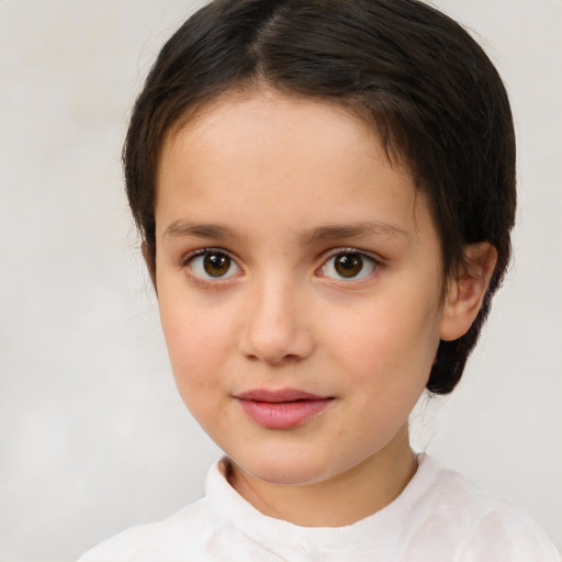 Joyful white child female with short  brown hair and brown eyes