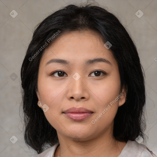 Joyful asian young-adult female with medium  black hair and brown eyes