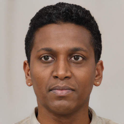 Neutral black young-adult male with short  brown hair and brown eyes