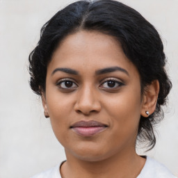 Joyful latino young-adult female with medium  black hair and brown eyes