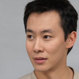 Neutral asian young-adult male with short  black hair and brown eyes