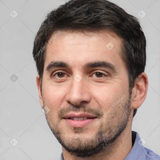 Joyful white young-adult male with short  black hair and brown eyes