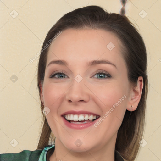 Joyful white young-adult female with medium  brown hair and blue eyes