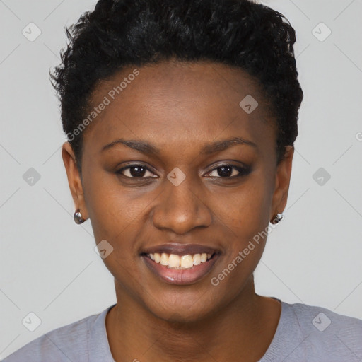 Joyful black young-adult female with short  black hair and brown eyes