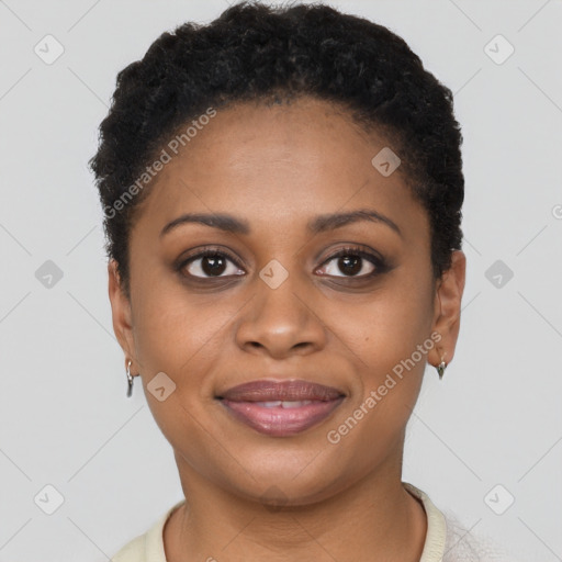 Joyful black young-adult female with short  brown hair and brown eyes