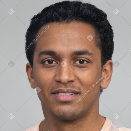 Joyful black young-adult male with short  black hair and brown eyes