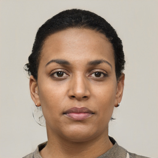 Neutral black young-adult female with short  black hair and brown eyes