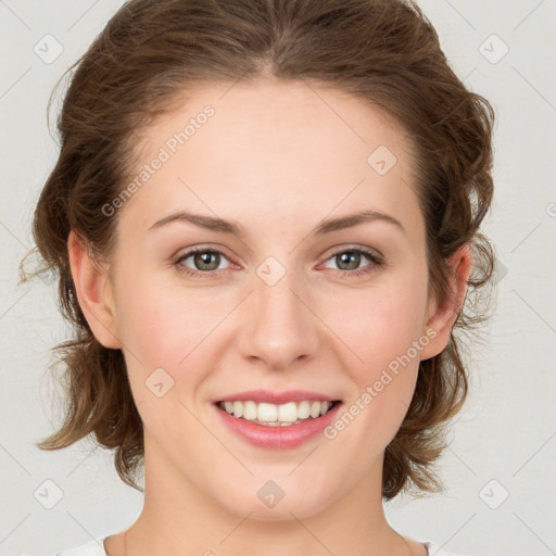 Joyful white young-adult female with medium  brown hair and green eyes