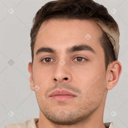 Neutral white young-adult male with short  brown hair and brown eyes